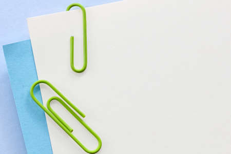 Blank white business cards, over pastel blue and white background.の写真素材