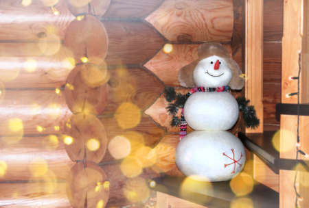 Christmas still life decoration with snowman on wooden background.の写真素材