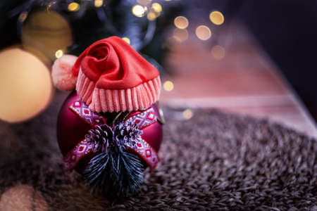 Christmas card on the background of fir branches with de focal lights of garlandsの写真素材