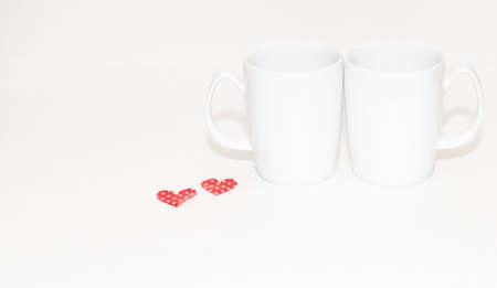 Valentine theme with coffee mugs and heartsの写真素材