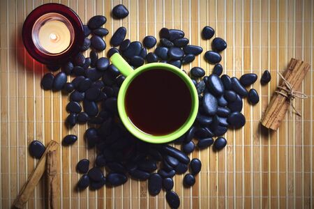 Red tea on stones and relaxed atmosphereの写真素材
