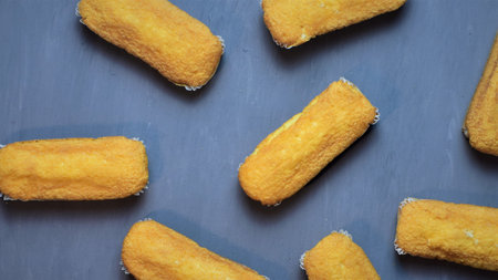 Rectangular muffins, on painted wooden background