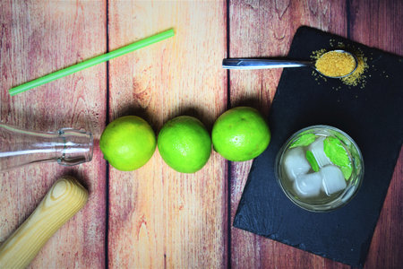 Group of three limes on rustic background
