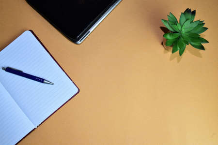 Work area, small notepad and notebook, space for textの写真素材