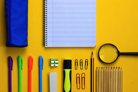 Yellow background. Assorted school supplies various, space for textの写真素材