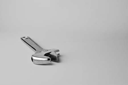 Variable wrench in black and white, space for textの写真素材