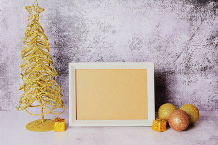 Merry Christmas, frame with space for text or idea and assorted decoration. Stone background.
