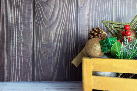 Christmas decorations in a wooden box, preparing for these special and family days. Merry Christmas.