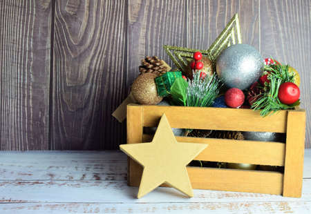 Christmas decorations in a wooden box, preparing for these special and family days. Merry Christmas.の写真素材