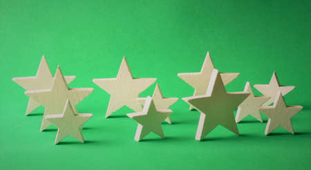White stars on green background, representation of Christmas.の写真素材