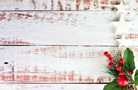 Rustic table, on it a bouquet of mistletoe and scattered white stars. Representation Christmas...