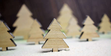 Interpreting in the shot, macro tree in the middle of a snowy forest with more in the backgroundの写真素材