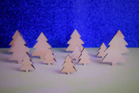 Interpreting in the shot, macro tree in the middle of a snowy forest with more in the backgroundの写真素材