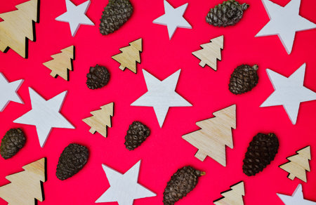 Small assorted Christmas decorations on red background. Merry Christmas.の写真素材