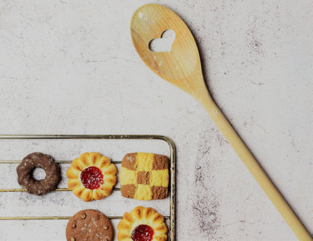 Stone background, assorted cookies on the oven rack trayの写真素材
