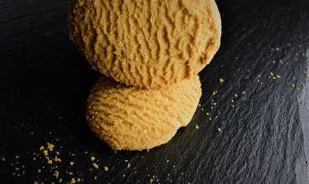 Macro, wheat flour cookie, with dark background