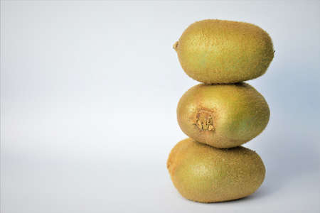 Close up, kiwis one on top of the other, tropical fruit, complete and healthy. Space for text or idea.の写真素材