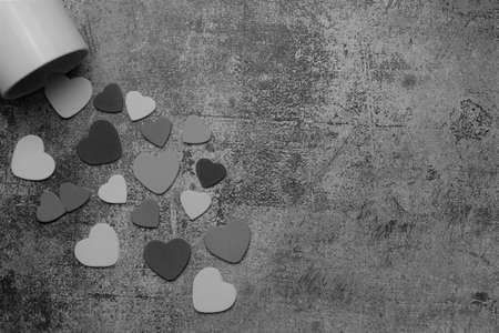 Zenith view. Hearts, love, valentine. Shot in monochrome with stone background and space for text or idea.の写真素材