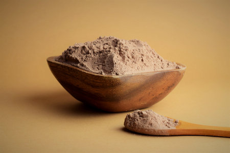 Bowl full of cocoa powder. Close up and copy space.
