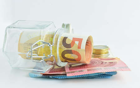 Economic concept. Euros, bills and coins of different amounts. Light background and copy space.の写真素材