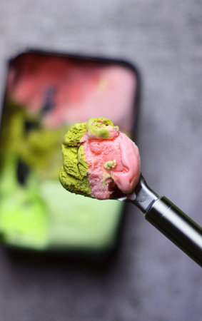 Close up. Ice cream scoop, with various flavors. Zenith view.