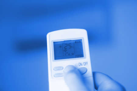 Adjust air conditioning, temperature, ideal in hot months. Monochromatic blue.の写真素材