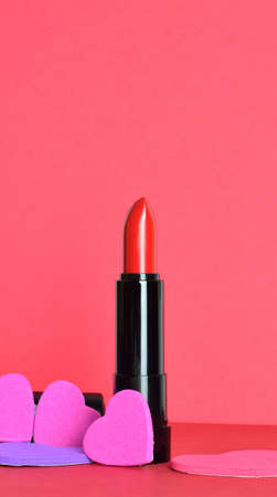 Deep red lipstick, warm contours and decorative hearts. Copy space.の写真素材
