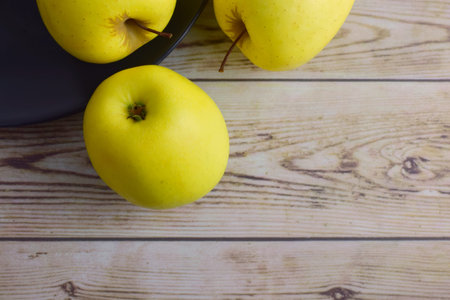 Zenith view, yellow apples on old woods. Copy space.の写真素材
