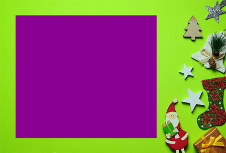 Christmas postcard creation, colorful, space for idea on purple background. Decoration on green...