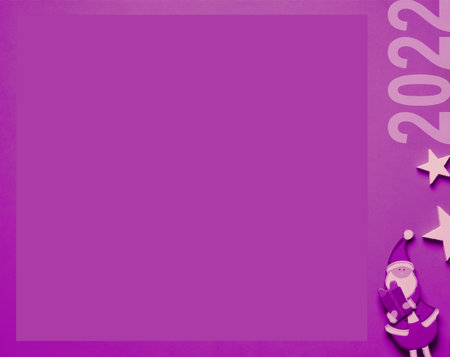 Creation of a purple Christmas postcard, small decoration and copy space.