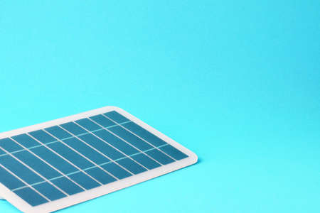 Photovoltaic solar panel on blue background and copy space.の写真素材