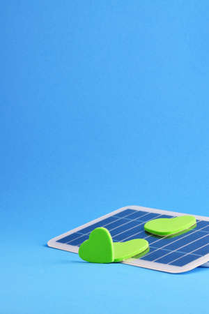 Vertical shot, solar panel, concept, take advantage of renewable energy that benefits everyone. Blue background and copy space.の写真素材