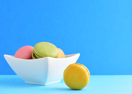 Macaroons, sweets, on blue background, typical french.の写真素材