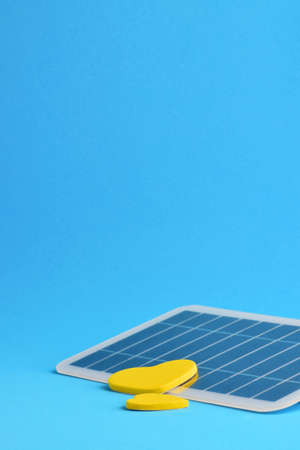Vertical shot, solar panel, concept, take advantage of renewable energy that benefits everyone. Blue background and copy space.の写真素材