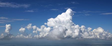The White greater clouds close the sky. They look like fantastic castleses in the air.の写真素材