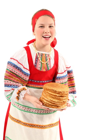 Little girl holds stack of pancakes in her hands on white background.の写真素材