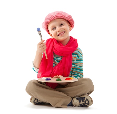Young artist holds in his hands the palette with paints の写真素材