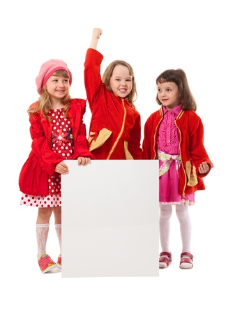 Three girls wear red clothes. They hold white billboard. It's isolated on white background.の写真素材