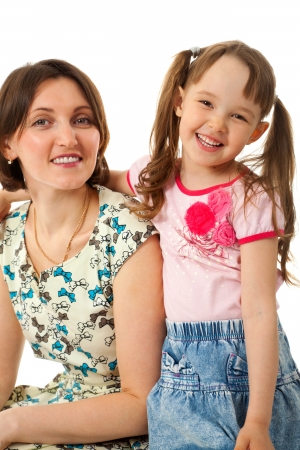 Little girl hugging her mother.の写真素材