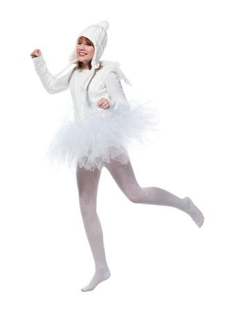 Teenage girl is wearing costume of white angels during masquerade party, isolated on white backgroundの写真素材