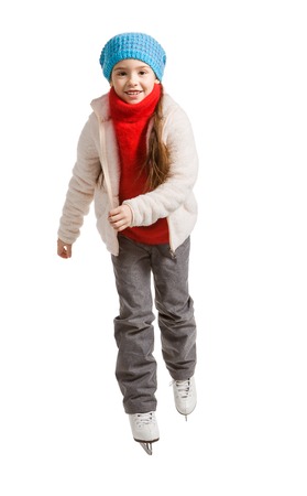 pretty cheerful little girl in thermal suits skating, isolated on whiteの写真素材