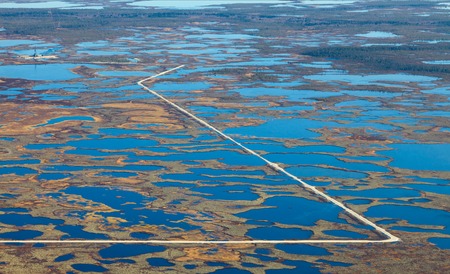 Aerial view of oilfield on impassable swamp area.の写真素材