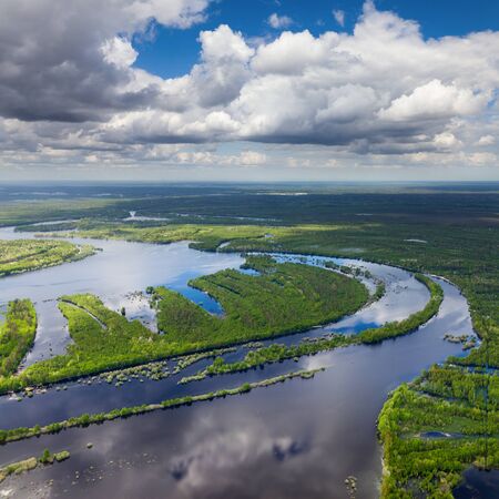 It is top view the place of flood of forest river in forest during spring day.の写真素材