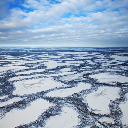Aerial view swampy area during frosty winter day.の写真素材