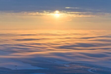 Beautiful sunset over clouds, top viewの写真素材