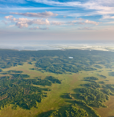 Forest near big river in flooding period, top viewの写真素材