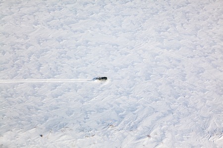 Trucks in winter tundra from aboveの写真素材