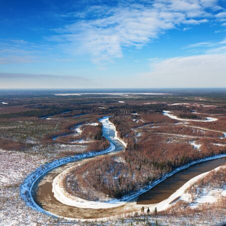forest river in cold winter day, top viewの写真素材