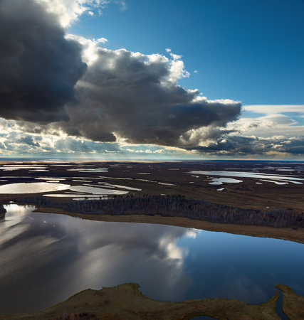 Cloudy day in the tundra in autumn, aerial view.の写真素材