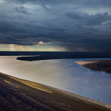 Cloudy day on the Great river in autumn, aerial view.の写真素材